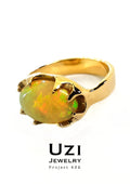 14K GOLD RING WITH CENTER NATURAL WELO OPAL & BLACK DIAMOND ON THE SIDE